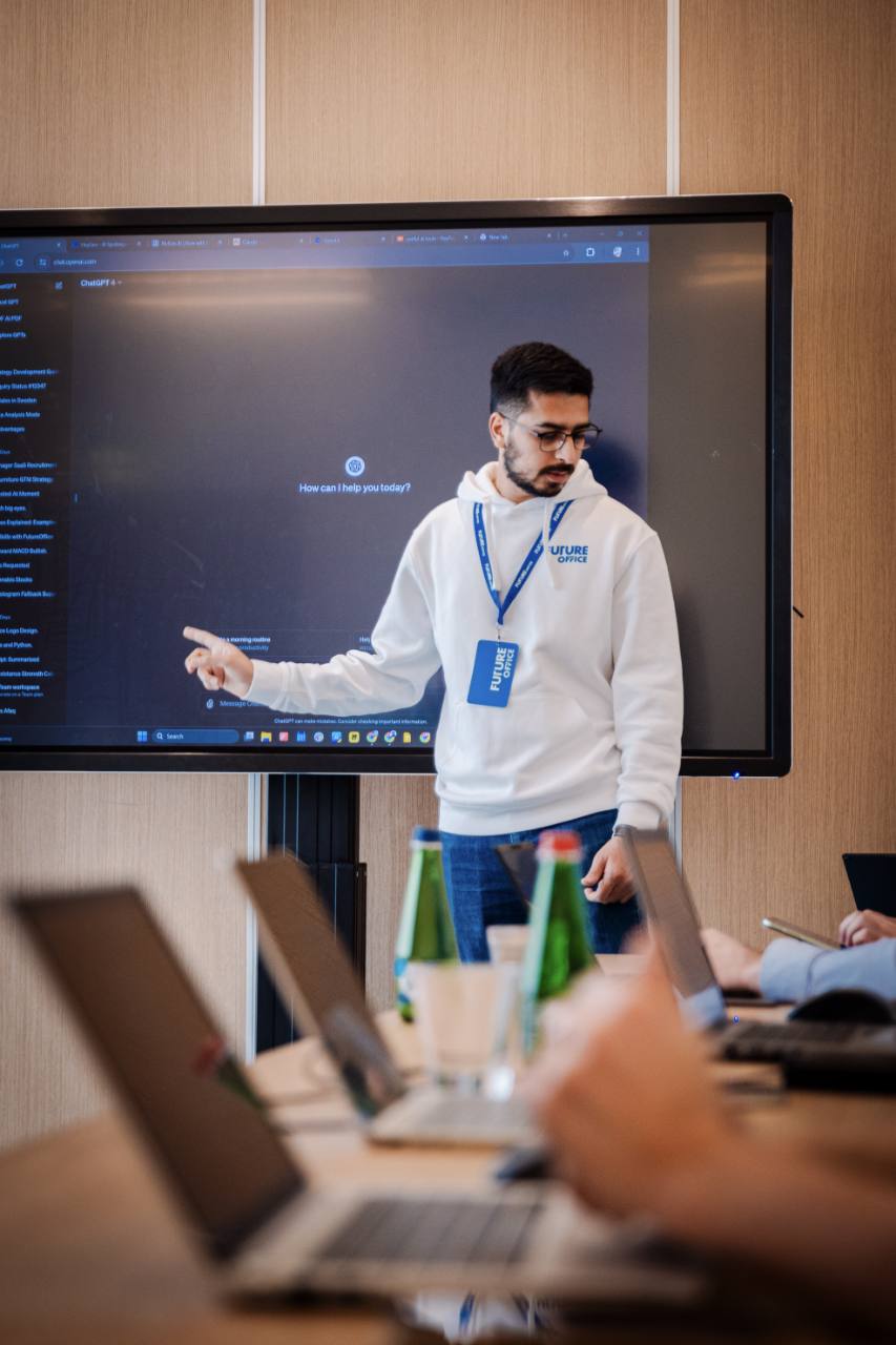 Owais discussing AI with a group around a table